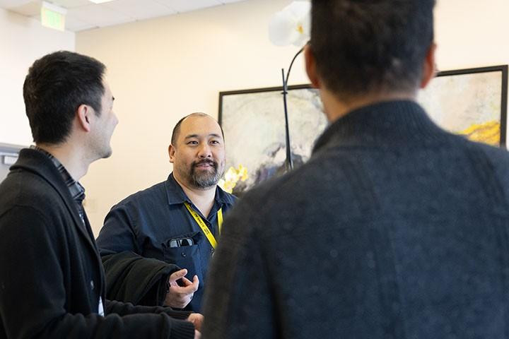 Staff mingling at AAPI reception